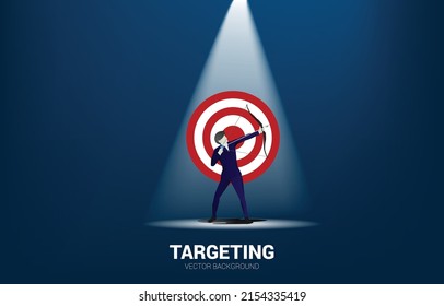 Businessman in suit shoot the arrow to target . Business Concept of marketing target and customer.