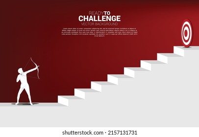 Businessman in suit shoot the arrow to target on step stair. Business Concept of marketing target and customer.