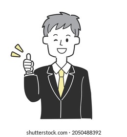 A businessman in a suit that is thumbs up