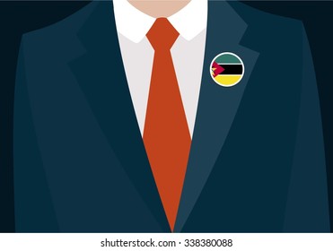 Businessman In Suit Wearing Mozambique Badge. Country flag badge closeup. Vector illustration.