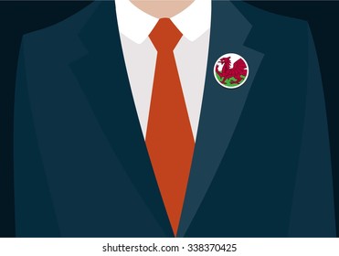 Businessman In Suit Wearing Wales Badge. Country flag badge closeup. Vector illustration.