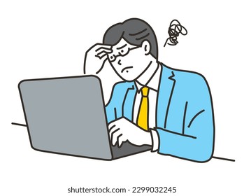 A businessman in a suit who is worried in front of a computer