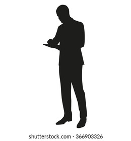 Businessman with tablet, vector silhouette