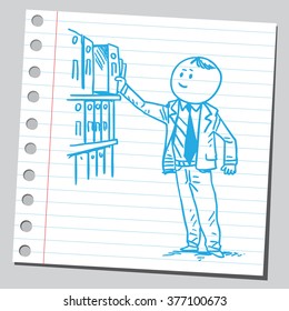 Businessman taking binder from shelf