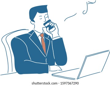 Businessman taking a coffee break at the office desk.