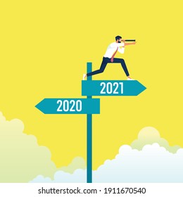 Businessman with telescope standing and looking into the distance on abstract year 2020, 2021 direction sign board 