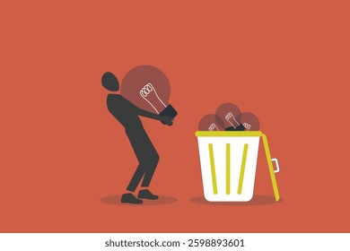 Businessman throw away lightbulb idea into full of junk idea in basket bin. concept of Wasted unworkable ideas, business failure or too many abandoned projects