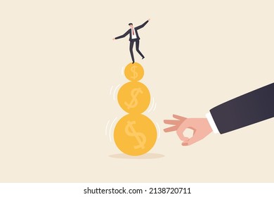 A businessman tries to keep his balance by walking on gold coins. financial and business risks and liabilities Stability or balance of economics and investments.