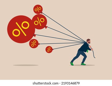 Businessman tries to pull down many inflation balloons. Reserve try to tame inflation down by interest rate hike. Stop inflation, Inflation bubble. 