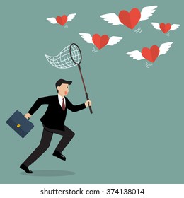 Businessman trying to catch hearts flying. Valentine's day