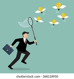 Businessman trying to catch lightbulb idea. Business idea concept