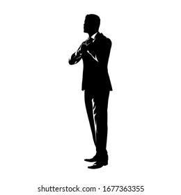 Businessman tying tie. Ink drawing, isolated vector silhouette. Groom oneself, make up