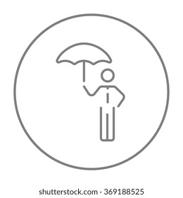 Businessman with umbrella line icon.