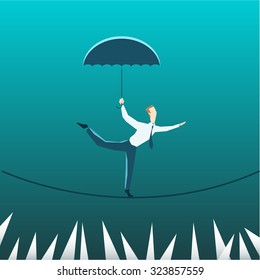 Businessman with an umbrella over the precipice