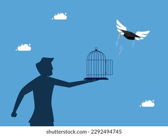 Businessman unleashes graduation cap flying out of the cage. Liberation of learning achievements and freedom