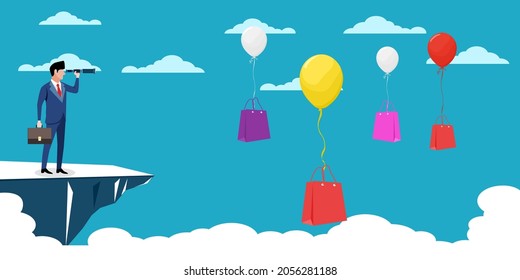  A businessman uses binoculars to look for a shopping bag. shopping concept