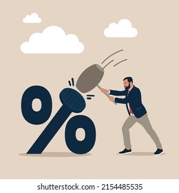 Businessman using hammer to nailed percentage sign to the floor. Federal Reserve low interest rate or central bank with long time zero percent interest rate until economic recover concept.