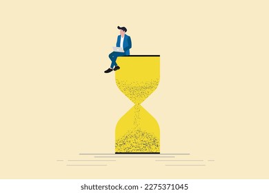 Businessman using laptop sitting on an hourglass. Concept of multitasking, productivity and time management