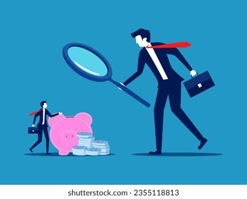 Businessman using a magnifying glass to examine the piggy bank