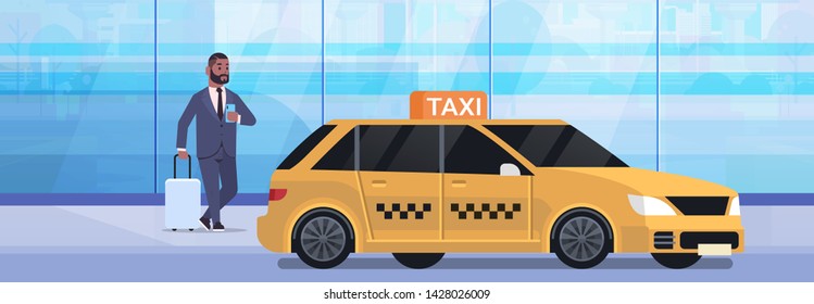 businessman using mobile app ordering taxi on street african american business man in formal wear with luggage near yellow cab city transportation service concept full length flat horizontal