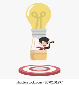 businessman using a telescope with hot air balloon target red