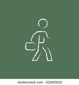 Businessman walking with briefcase hand drawn in chalk on a blackboard vector white icon isolated on a green background.