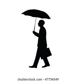 Businessman walking with briefcase and umbrella.
