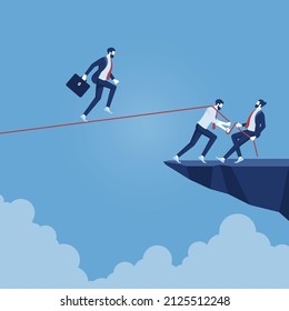 businessman walking on rope walk way pulled by team, concept for teamwork and support