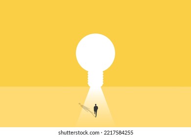 businessman walking through light bulb shape door, creative concept.