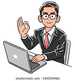 A businessman wearing glasses operating a computer gives an OK sign