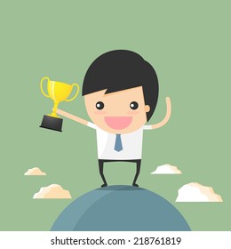 businessman winner holding trophy on the world