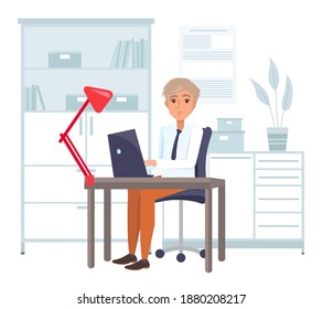 Businessman working at the computer sitting at a table in office space. A man wearing formally looking at the laptop screen typing on the keyboard. Freelancer doing work on the computer at home office