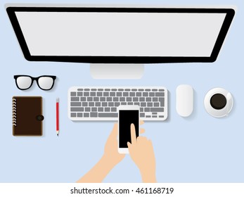 Businessman working at office desk and using a digital tablet, computer, laptop and various objects all around, top view