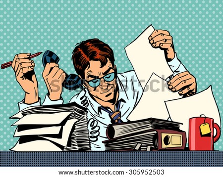 Businessman working on papers. A man sits at a Desk and looking at the reports