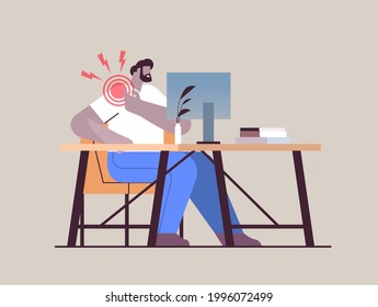 businessman at workplace suffering from shoulder pain inflammation of muscles concept