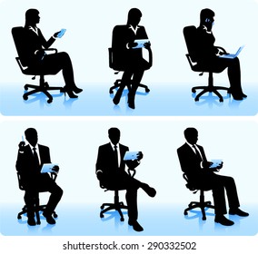 Businessmen in chairs with computers