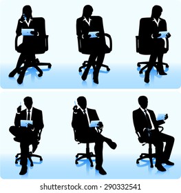 Businessmen in chairs with computers