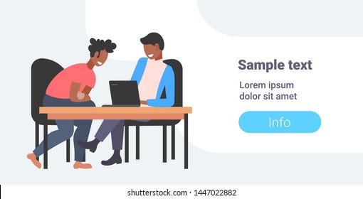 businessmen coworkers sitting at workplace desk two african american business men using laptop working process teamwork concept flat horizontal full length copy space