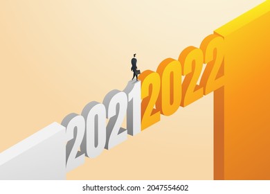 Businessmen cross the bridge forward from 2021 to 2022 for new challenges. of careers and businesses in 2022. isometric vector illustration.