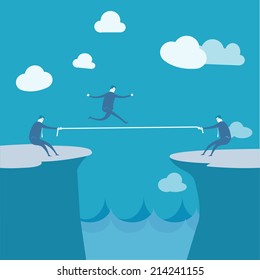 Businessmen Pulling together on a cliff 