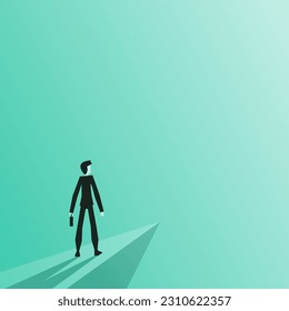 Businessmen standing on a cliff looking at the light of success or thinking about the adventure ahead. The concept of a forward-thinking leader and finding ways to make the organization evolve.