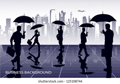 businessmen under umbrellas against the city