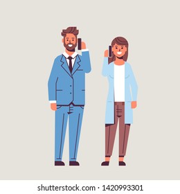 businesspeople couple using smartphones business man woman making calls talking on cellphone communication concept colleagues standing together flat full length