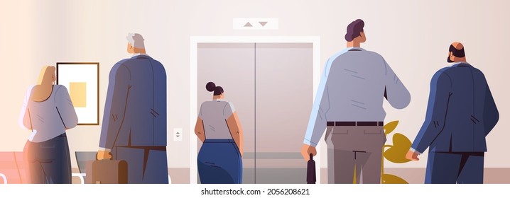 businesspeople standing back to camera rear view of business people group in office corridor