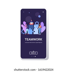 businesspeople using digital devices jigsaw puzzle parts teamwork solution business process concept mix race colleagues working together smartphone screen mobile app copy space full length vector