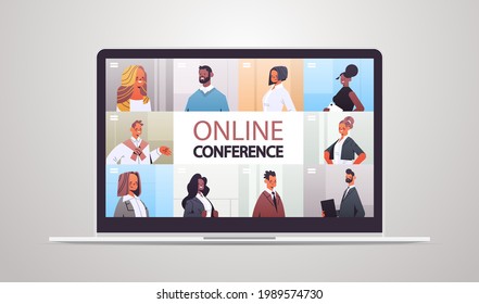 businesspeople in web browser windows discussing during corporate online conference