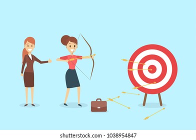 Businesswoman aiming in target and shooting with arrow.