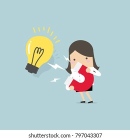 Businesswoman attracting light bulbs with a large magnet. vector