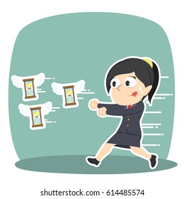 businesswoman chasing flying hourglass