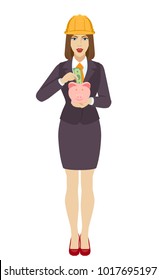 Businesswoman in construction helmet puts banknote in a piggy bank. Full length portrait of businesswoman in a flat style. Vector illustration.